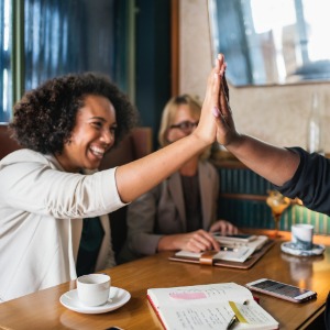 Your Journey An apprentice and assessor celebrating the candidate's achievement.